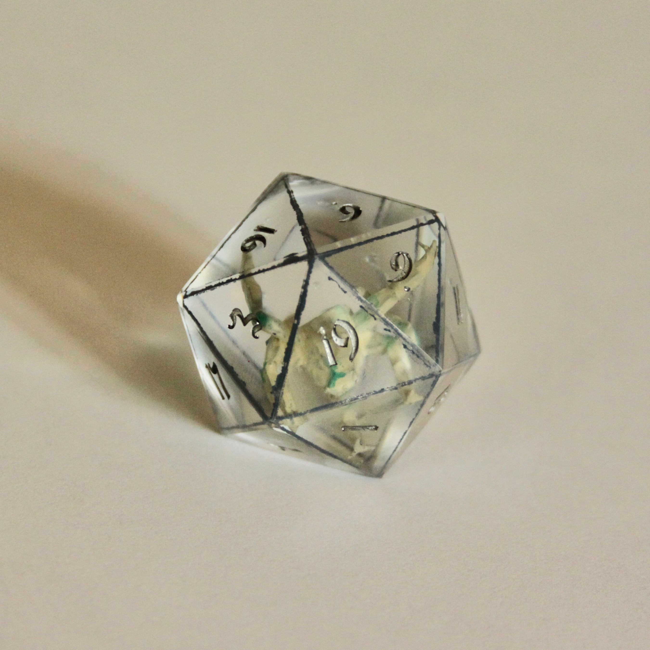 Rocky d20 with dark grey border